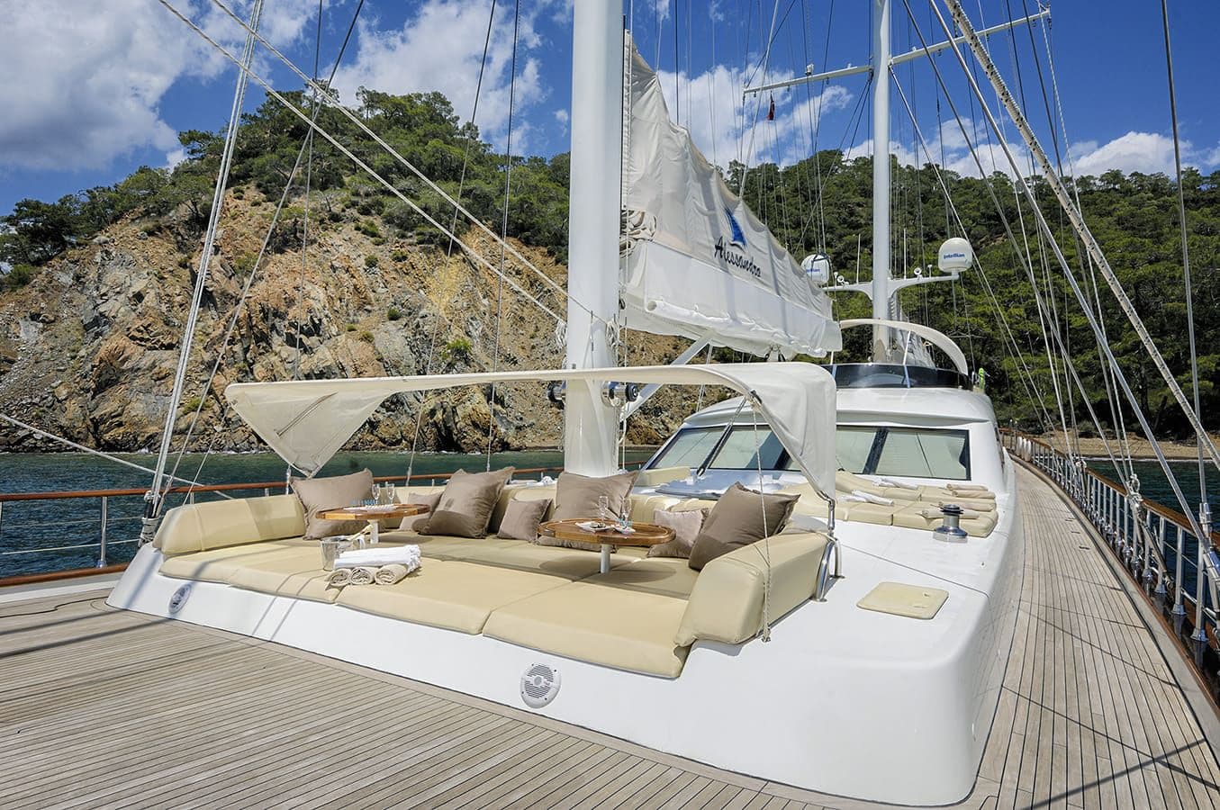 Foredeck lounge with cream cushions and island views
